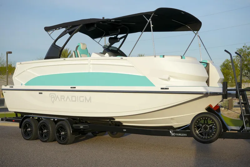 The Image of 2026 Paradigm 266 SL SURF boat on trailer, featuring sleek design and modern features. - 1