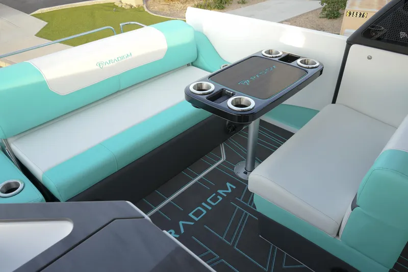 Slide: The Image of Luxurious seating area on 2026 Paradigm 266 SL SURF boat with cupholders and stylish design. - 10