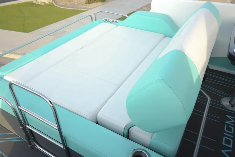 Slide: The Image of 2026 Paradigm 266 SL SURF boat seating with teal and white upholstery. - 12