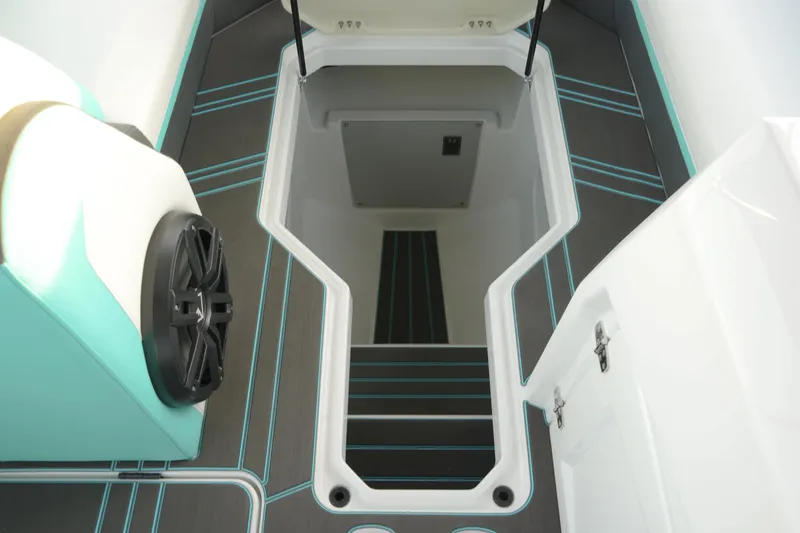 Slide: The Image of Interior view of 2026 Paradigm 266 SL SURF boat with modern design and storage compartment. - 13