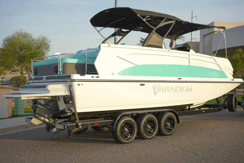 Slide: The Image of 2026 Paradigm 266 SL SURF boat on trailer, featuring sleek design and modern amenities. - 3