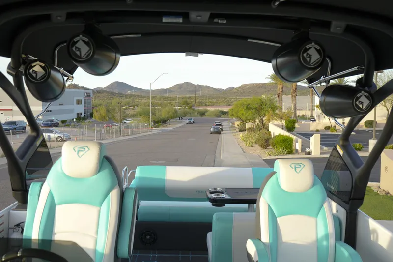 Slide: The Image of Interior view of 2026 Paradigm 266 SL SURF boat with stylish seating and speakers. - 7