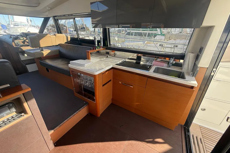 Slide: The Image of Luxurious interior of 2016 Prestige 450S yacht with modern kitchen and seating area. - 14