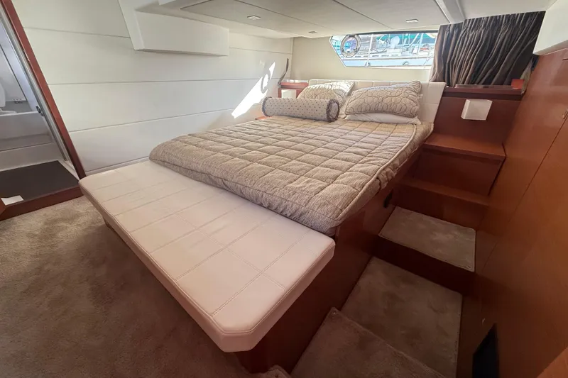 Slide: The Image of Luxurious bedroom interior of 2016 Prestige 450S yacht with cozy bedding and elegant design. - 19