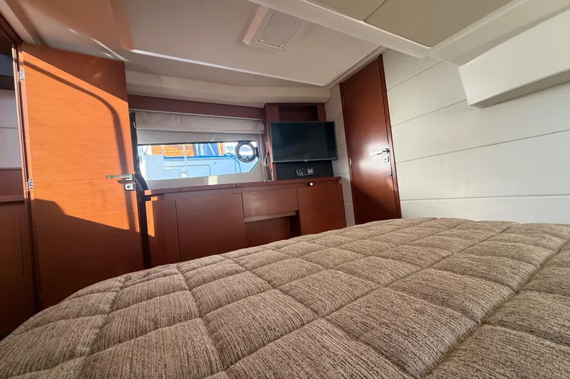 Slide: The Image of Luxurious cabin interior of 2016 Prestige 450S yacht with bed and TV. - 22