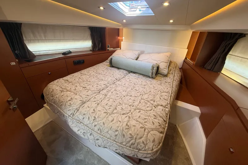 Slide: The Image of Luxurious cabin interior of 2016 Prestige 450S yacht with elegant bedding and ambient lighting. - 24