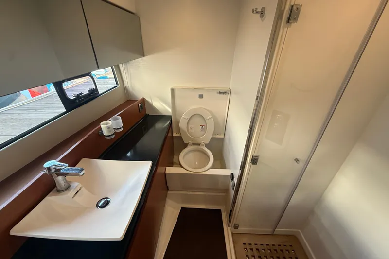 Slide: The Image of Modern bathroom in 2016 Prestige 450S yacht with sink, toilet, and shower. - 25