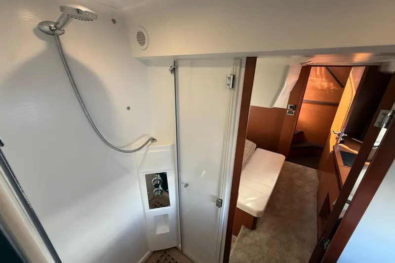 Slide: The Image of Interior of 2016 Prestige 450S yacht showing shower and cozy cabin area. - 27