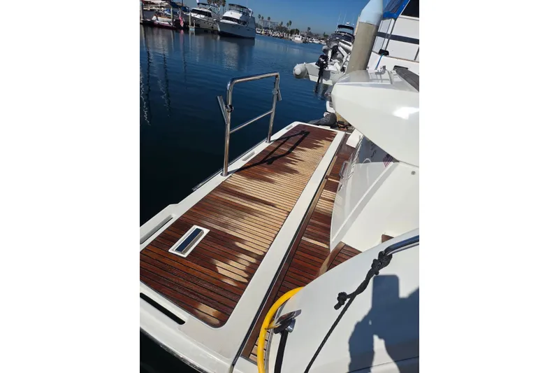 Slide: The Image of 2016 Prestige 450S yacht with teak deck at marina. - 31