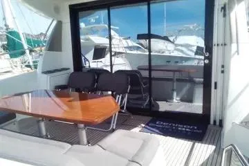 Slide: The Image of 2016 Prestige 450S yacht with outdoor seating and glass doors. - 5