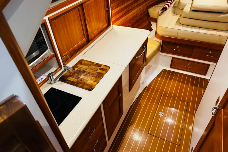 Slide: The Image of Luxurious interior of 2015 MJM 36z Express yacht with wooden cabinetry and modern amenities. - 10