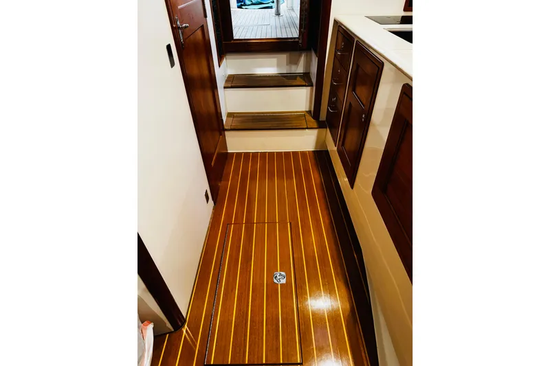 Slide: The Image of 2015 MJM 36z Express interior with polished wooden flooring and cabinetry. - 19