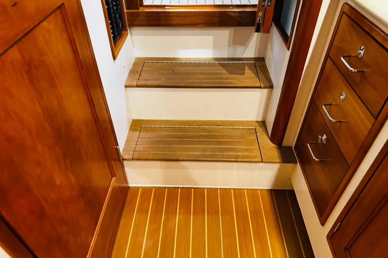 Slide: The Image of Interior of 2015 MJM 36z Express yacht with wooden steps and cabinetry. - 23