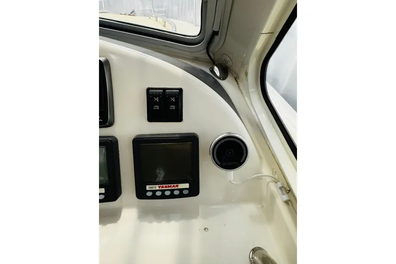 Slide: The Image of 2015 MJM 36z Express dashboard with Yanmar display and controls. - 27