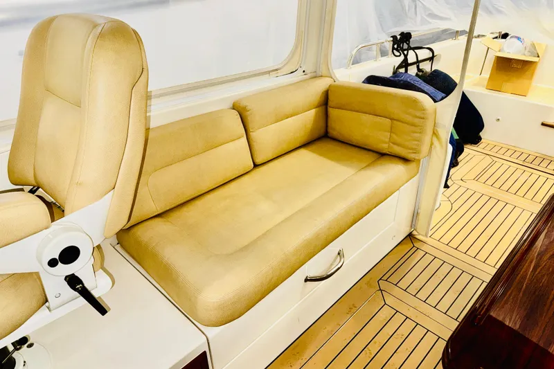 Slide: The Image of 2015 MJM 36z Express interior with beige seating and wooden flooring. - 34