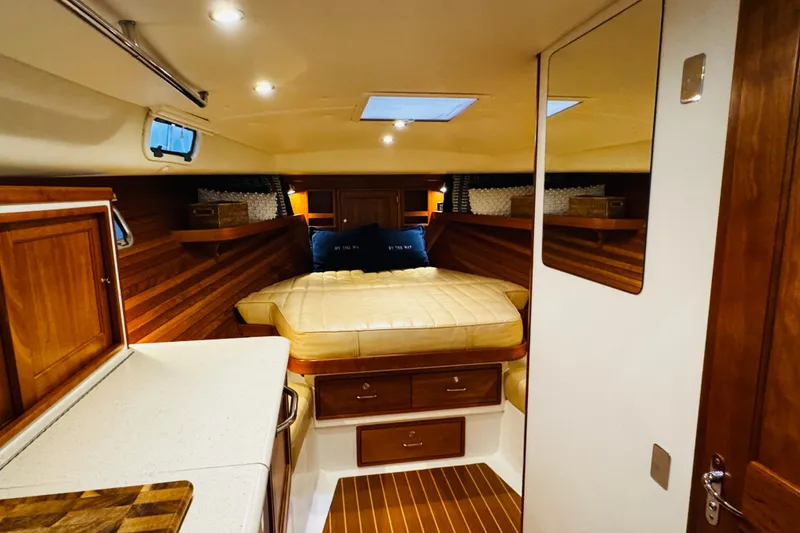 Slide: The Image of Luxurious cabin interior of 2015 MJM 36z Express yacht with cozy bed and wooden finishes. - 4