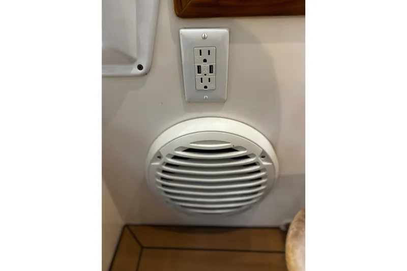 Slide: The Image of Power outlet and speaker on 2015 MJM 36z Express boat interior. - 45