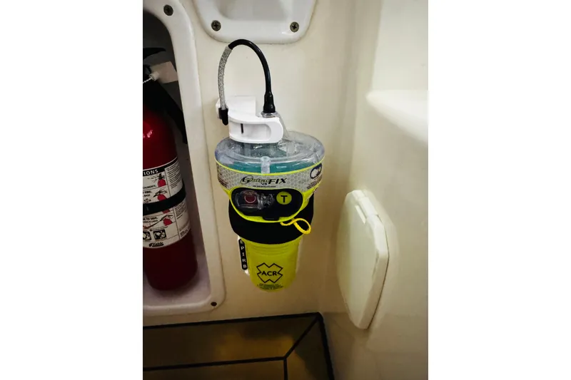 Slide: The Image of Safety equipment on 2015 MJM 36z Express boat, featuring ACR GlobalFix EPIRB and fire extinguisher. - 46