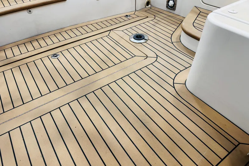 Slide: The Image of Teak deck of 2015 MJM 36z Express boat, showcasing elegant wood pattern and craftsmanship. - 47