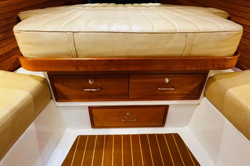 Slide: The Image of Interior of 2015 MJM 36z Express with wooden drawers and cushioned seating. - 5