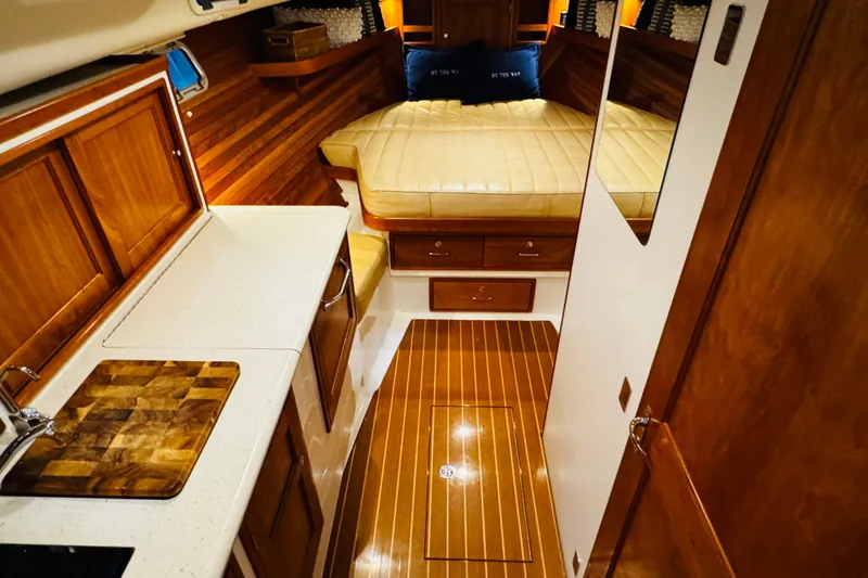 Slide: The Image of Luxurious interior of 2015 MJM 36z Express yacht with wood finishes and cozy cabin. - 7