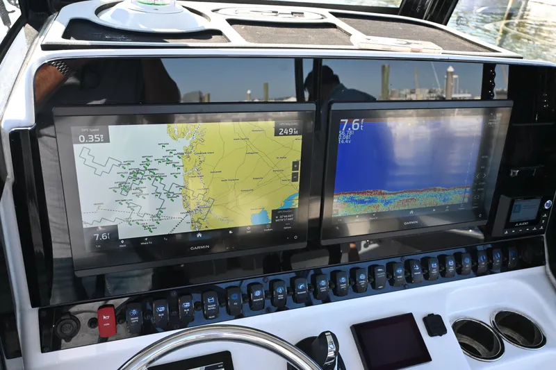 Slide: The Image of Dashboard of 2025 Sea Hunt Gamefish 30 Coffin Box with dual Garmin displays. - 12