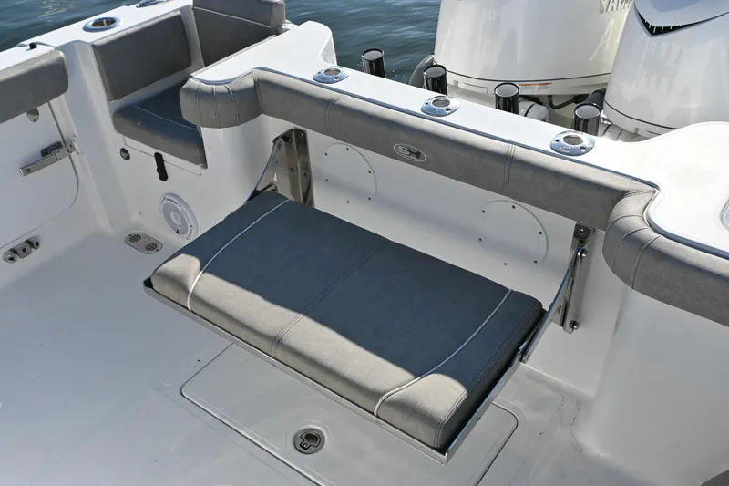 Slide: The Image of 2025 Sea Hunt Gamefish 30 Coffin Box boat seating area with cushioned bench. - 14