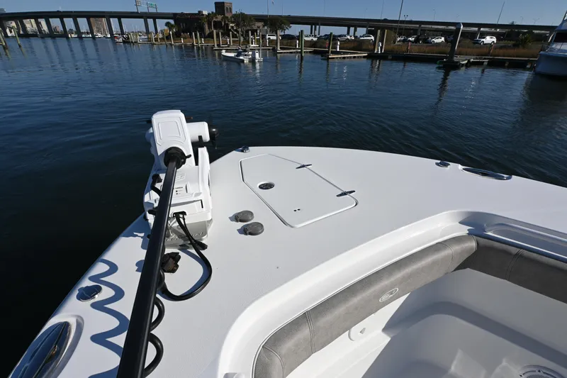 Slide: The Image of 2025 Sea Hunt Gamefish 30 Coffin Box boat at marina, featuring bow seating and trolling motor. - 15