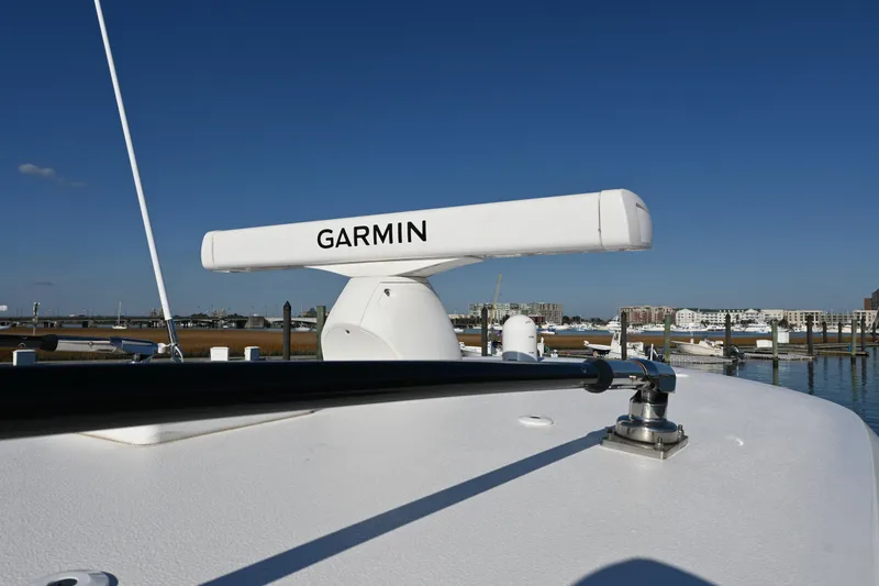Slide: The Image of 2025 Sea Hunt Gamefish 30 Coffin Box with Garmin radar, docked in a marina. - 18