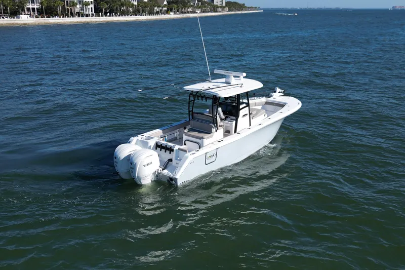 Slide: The Image of 2025 Sea Hunt Gamefish 30 Coffin Box boat cruising on open water. - 2