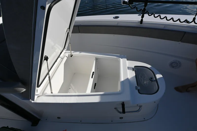 Slide: The Image of 2025 Sea Hunt Gamefish 30 Coffin Box open on deck, showcasing storage space. - 23