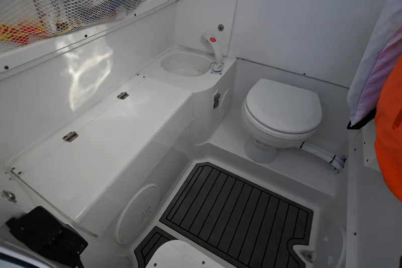 Slide: The Image of 2025 Sea Hunt Gamefish 30 Coffin Box boat interior with toilet and sink. - 24