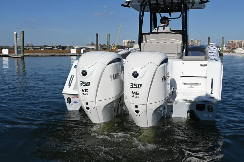 Slide: The Image of 2025 Sea Hunt Gamefish 30 Coffin Box with twin Yamaha 350 V6 engines in water. - 6