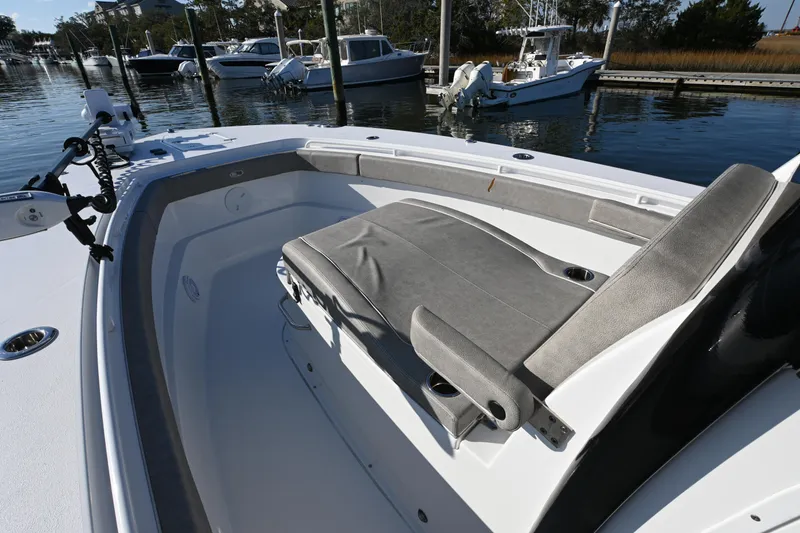 Slide: The Image of 2025 Sea Hunt Gamefish 30 Coffin Box boat interior with seating, docked in marina. - 8