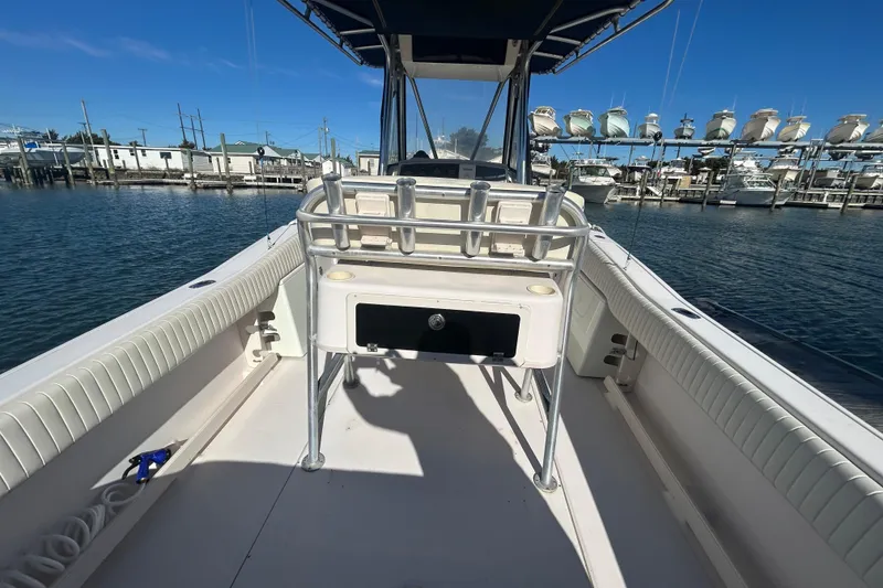 Slide: The Image of 2003 Grady-White Chase 273 boat interior at marina, clear blue sky. - 13