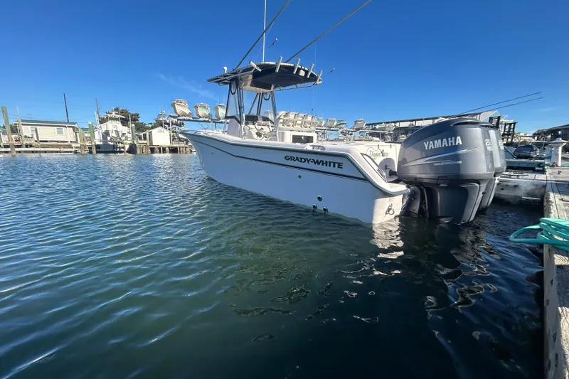 Slide: The Image of 2003 Grady-White Chase 273 boat docked with Yamaha outboard motor. - 3