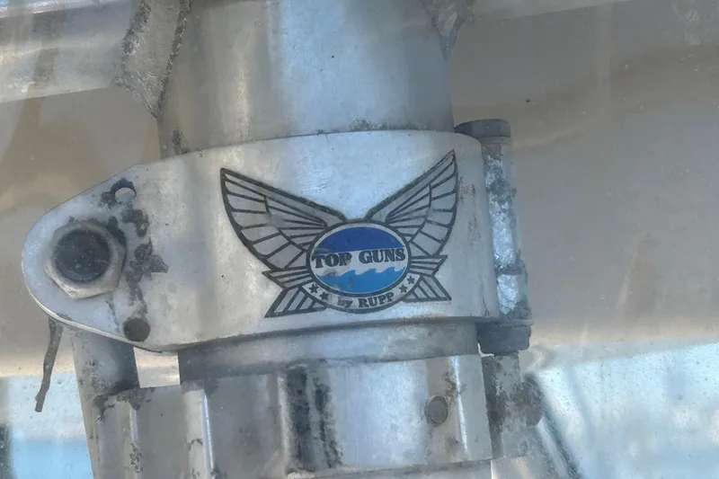 Slide: The Image of Top Guns by Rupp logo on Grady-White Chase 273, 2003 model boat component. - 30