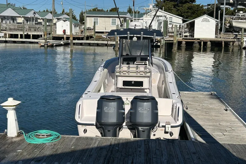 Slide: The Image of 2003 Grady-White Chase 273 boat docked at marina with twin 225 engines. - 6