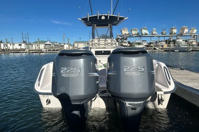 Slide: The Image of 2003 Grady-White Chase 273 boat with twin 225 horsepower engines docked at marina. - 8