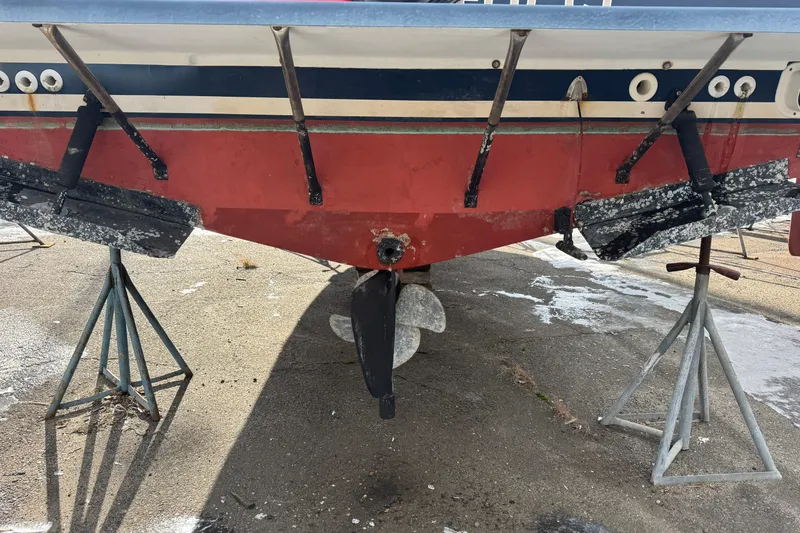 Slide: The Image of 2001 Albin 28 Tournament Express boat on stands, showing hull and propeller. - 18