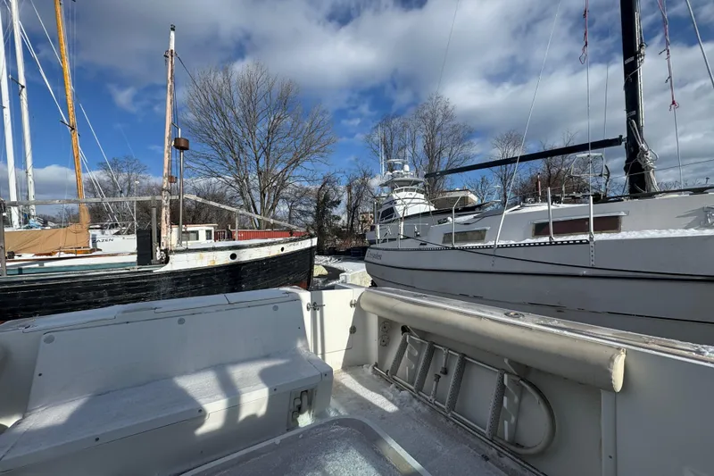 Slide: The Image of Boats docked in a marina, featuring a 2001 Albin 28 Tournament Express. - 2