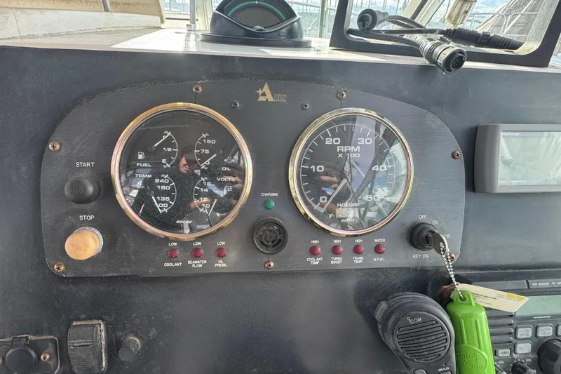 Slide: The Image of 2001 Albin 28 Tournament Express dashboard with gauges and controls. - 8