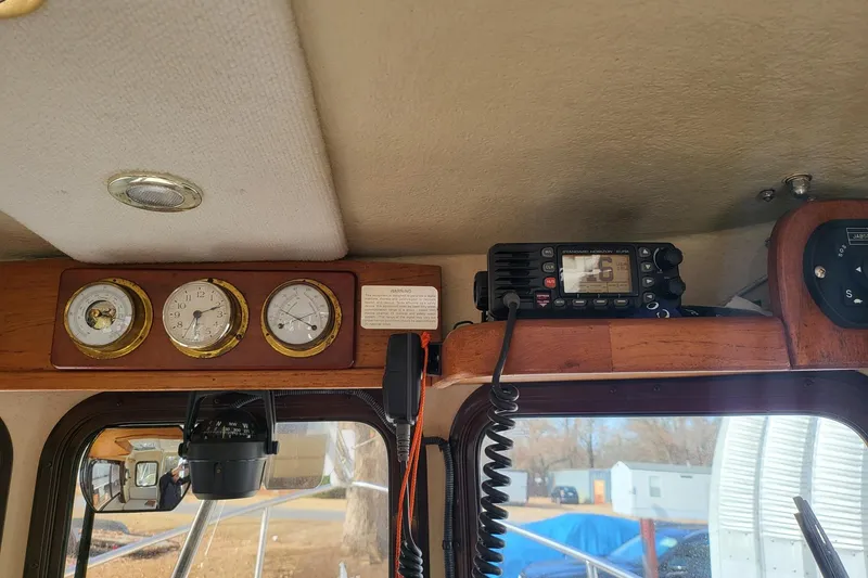 Slide: The Image of Interior of 2009 Ranger Tugs R-21 EC with gauges and radio equipment. - 6