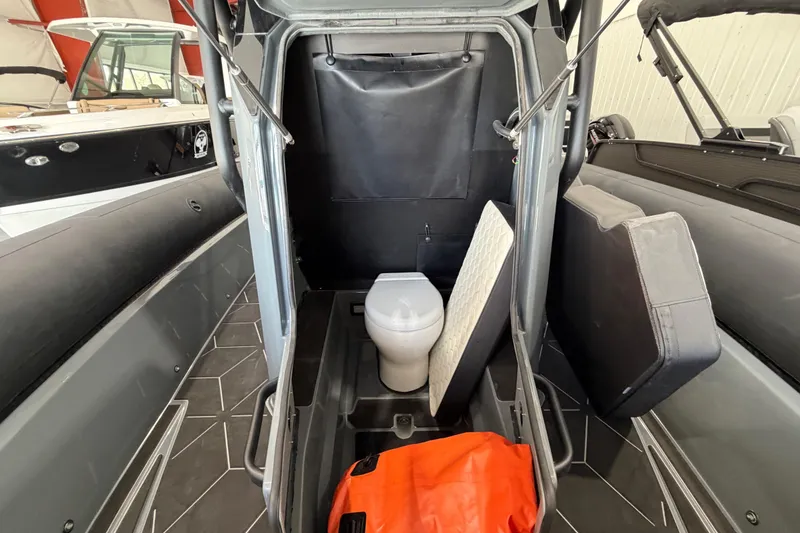 Slide: The Image of 2026 Highfield ADV 7 boat interior with toilet and storage area. - 12