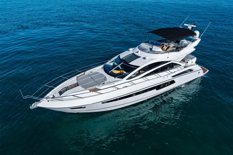 The Image of 2014 Sunseeker 68 Sport Yacht cruising on open blue waters. - 0