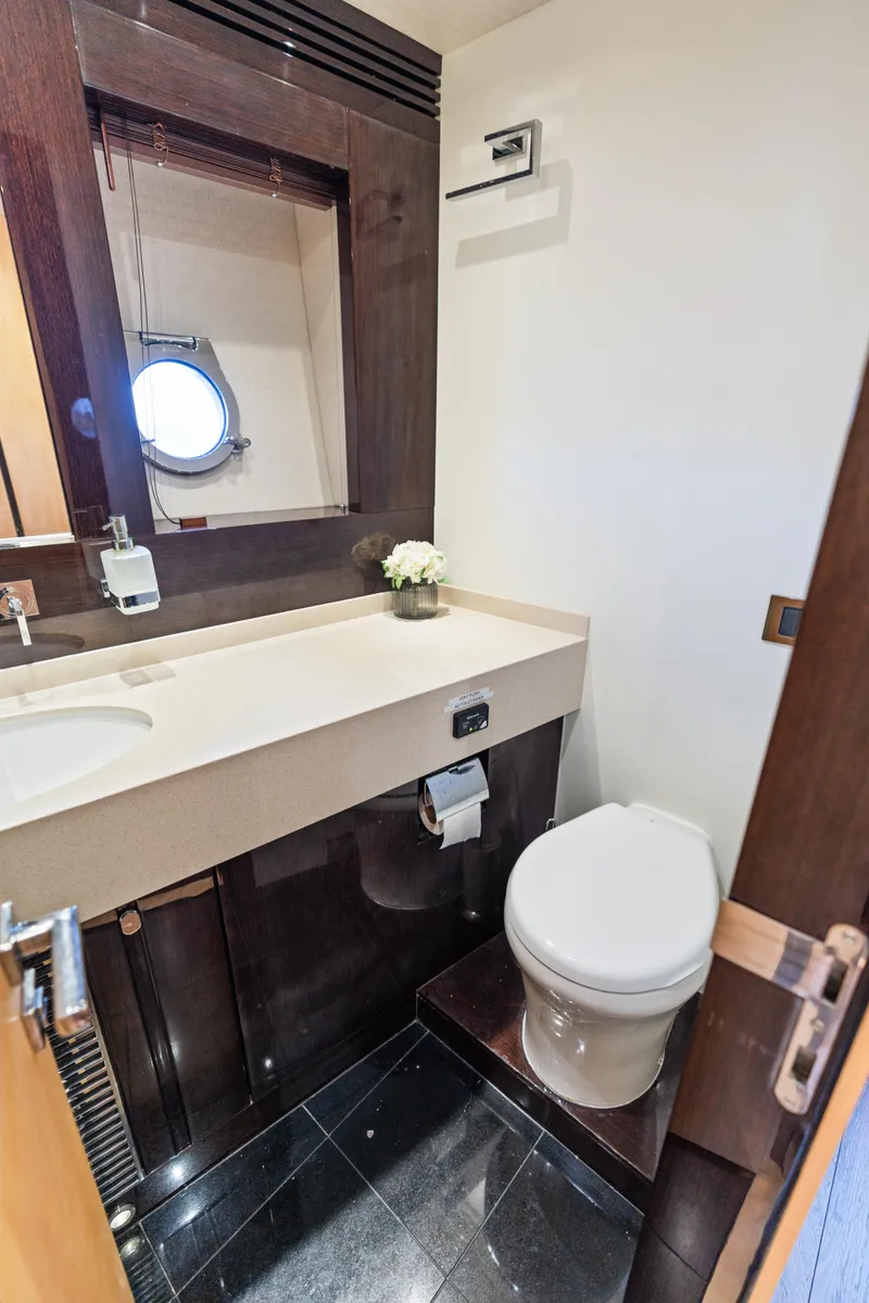 Slide: The Image of Luxurious bathroom in 2014 Sunseeker 68 Sport Yacht with modern fixtures and porthole window. - 22