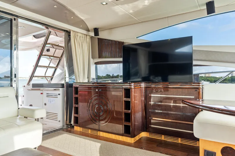 Slide: The Image of Interior of 2014 Sunseeker 68 Sport Yacht with twin beds and modern wood paneling. - 27