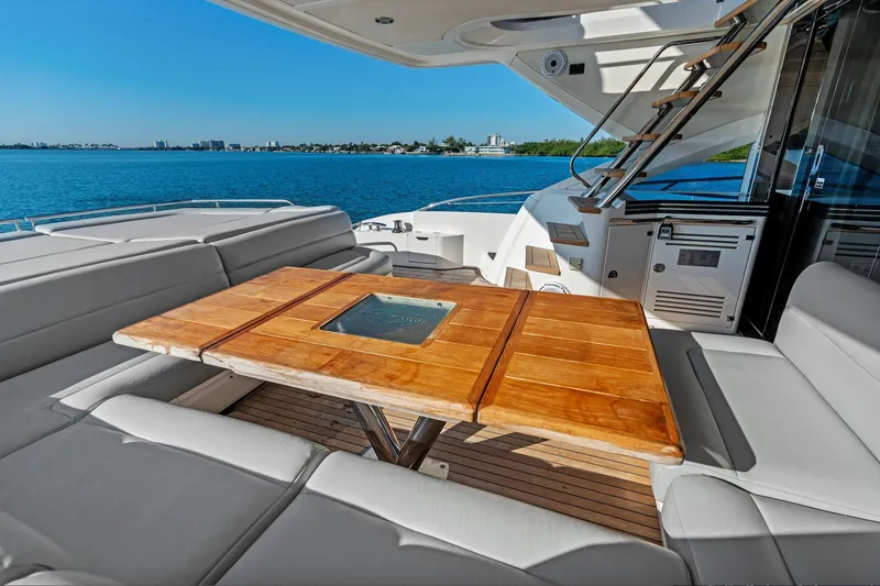 Slide: The Image of Luxurious Sunseeker 68 Sport Yacht 2014 with elegant deck seating and scenic water view. - 38