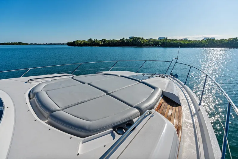 Slide: The Image of 2014 Sunseeker 68 Sport Yacht docked, featuring storage compartment with black fenders. - 52