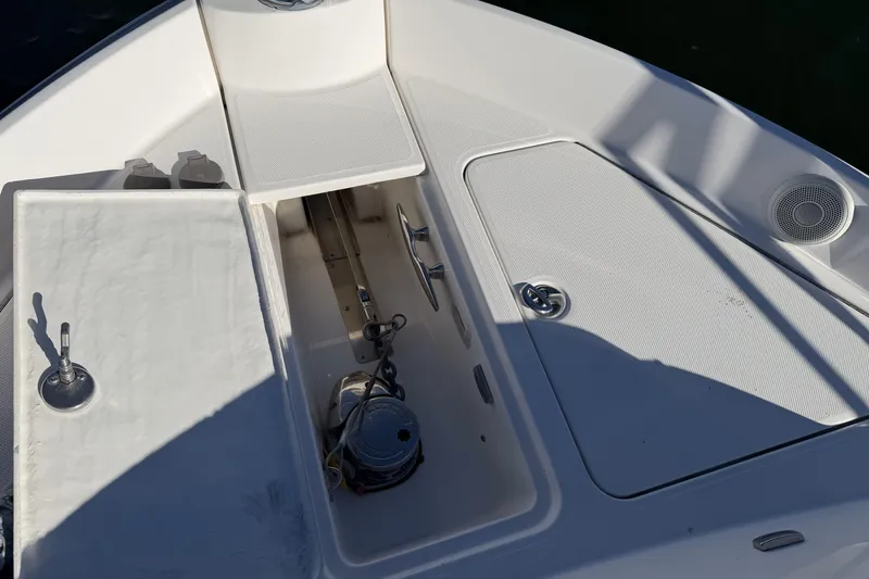 Slide: The Image of 2019 Regal 42 Grande Coupe boat deck with storage compartments and speaker. - 10